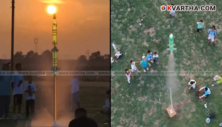A water rocket made from plastic bottles being prepared for launch by students.