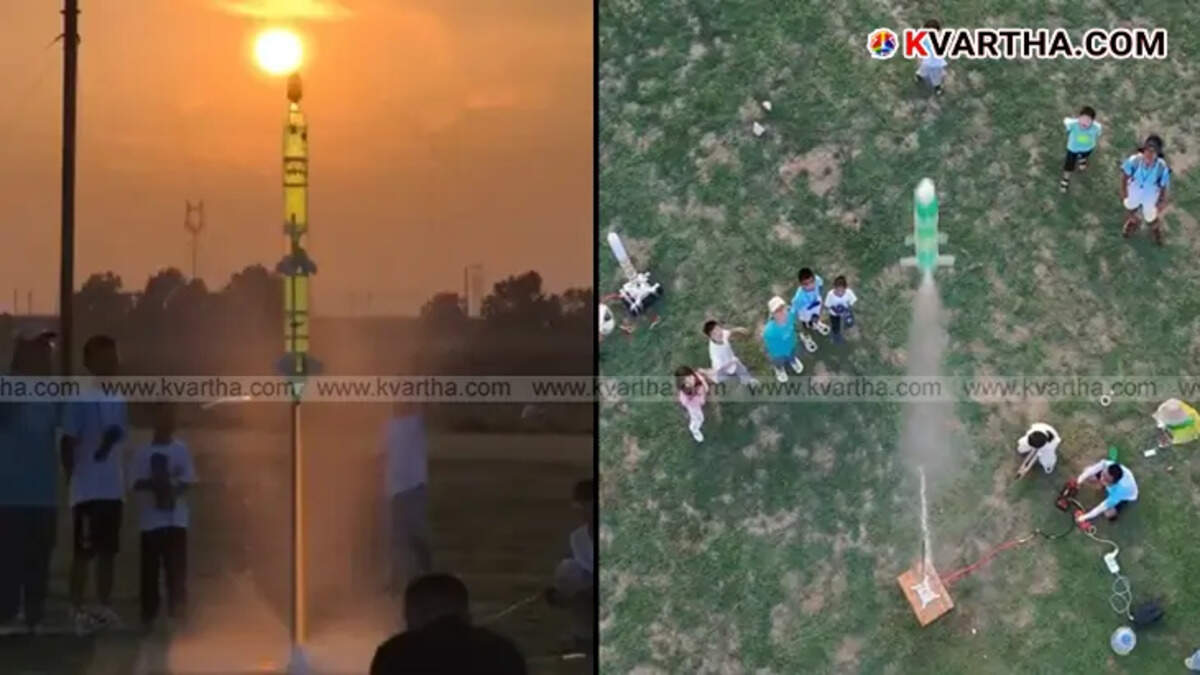 A water rocket made from plastic bottles being prepared for launch by students.