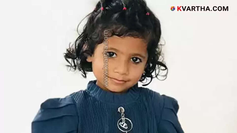 A smiling young girl, Fathimath Shabana, in her school uniform.