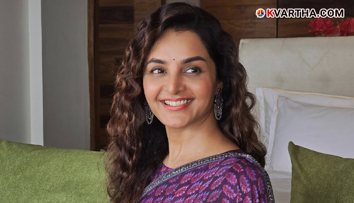 Malayalam actress Manju Warrier smiling.