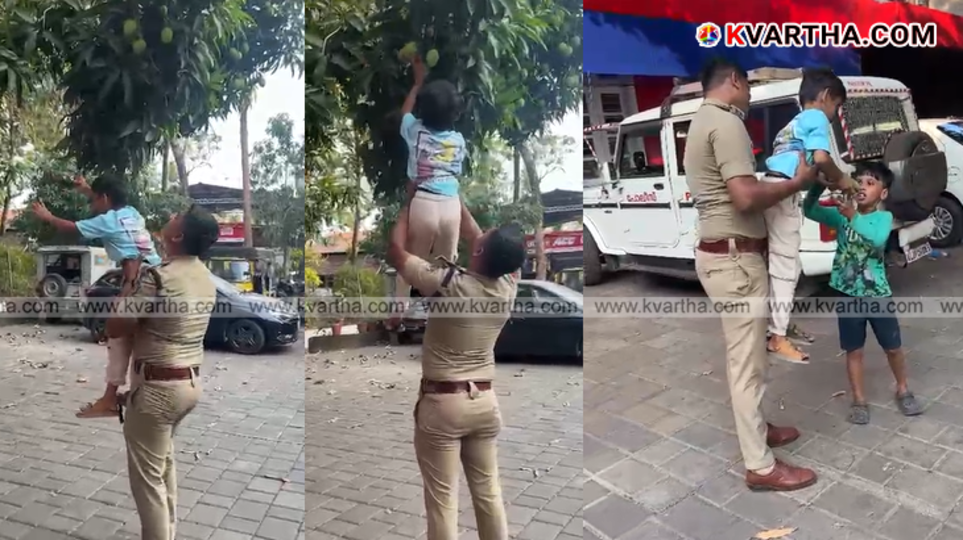 ASI Nived helping a small child reach a mango tree at Panoor police station.