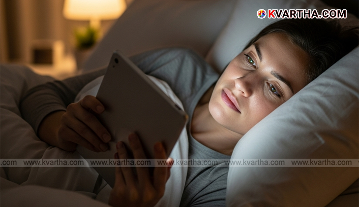 Person holding head with blurred screen background
