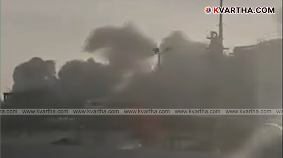 Rescue workers at a bombed building site in Iran following airstrikes
