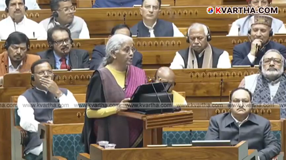  A person calculating taxes and filing Income Tax Return on a laptop.