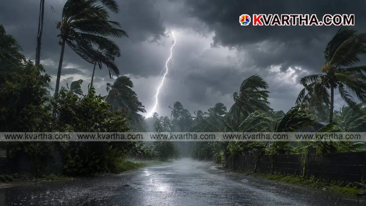  Heavy rain pouring over a city street in Kerala indicating monsoon weather