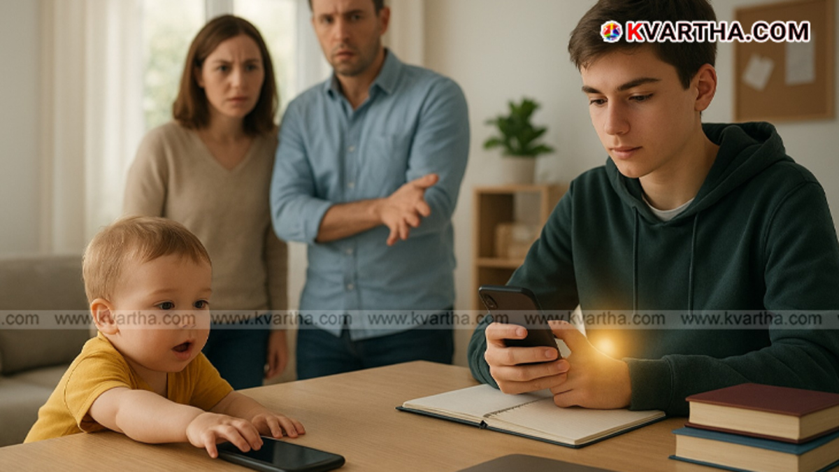 A young child sitting with a mobile phone in a home environment, with parents watching over, symbolizing the topic of the right age to give a phone to a child.