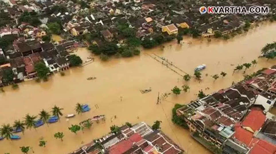 Flooded river and damaged infrastructure in central Vietnam after heavy rain.