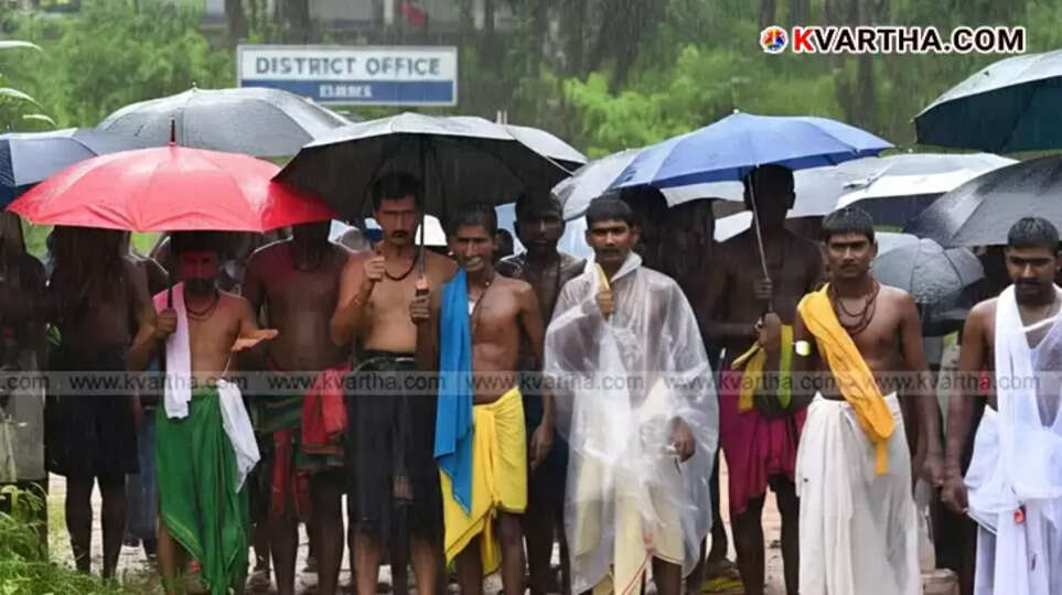 Nilambur tribals protesting in front of Malappuram Collectorate amidst heavy rain.