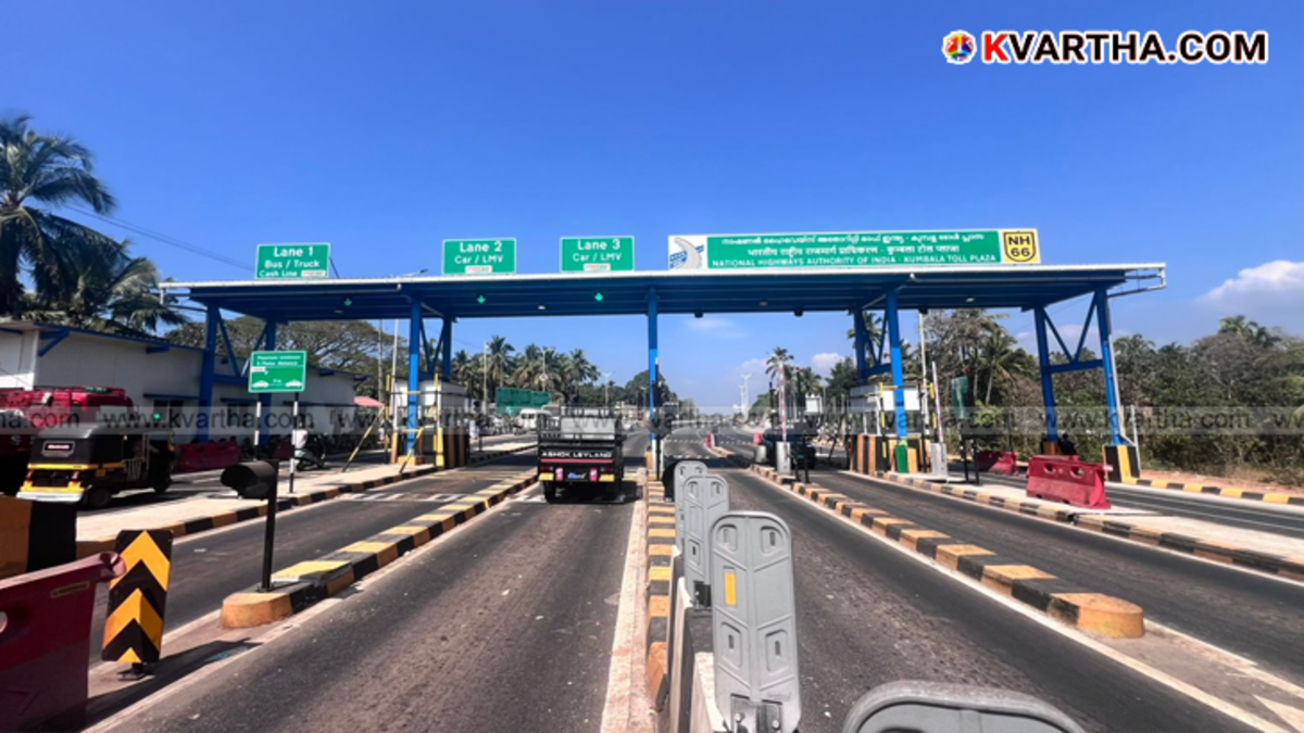 Workers and NHAI machinery removing toll structures at Arikkady, Kumbla.