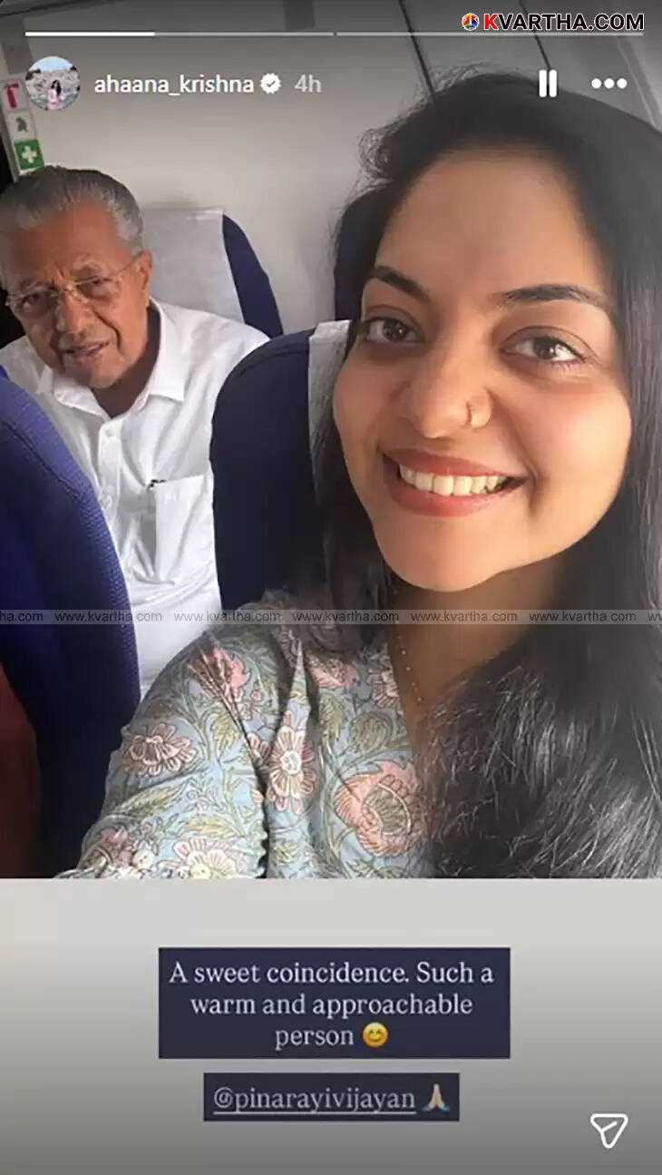 Ahaana Krishna and Pinarayi Vijayan smiling for a selfie on a plane.