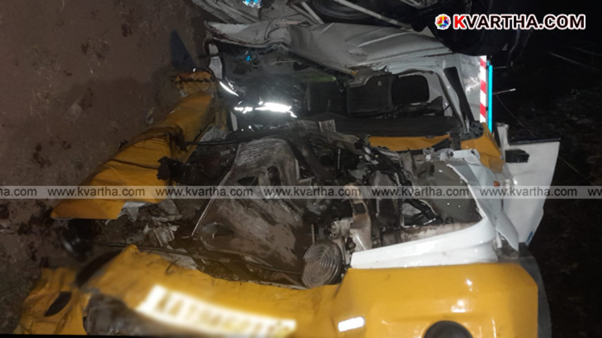 Severely damaged pickup van after colliding with a Volvo bus in Taliparamba.