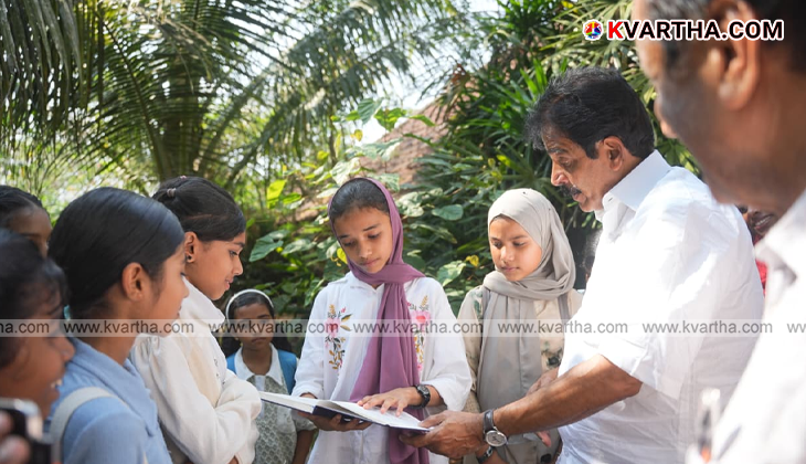 KC Venugopal listening to farmers in a paddy field in Palakkad.