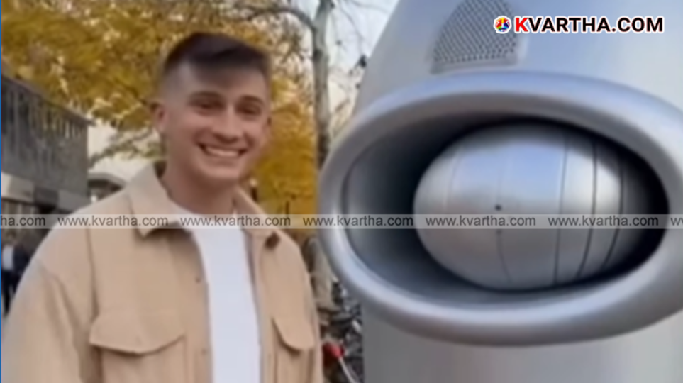 Man getting haircut from automated machine