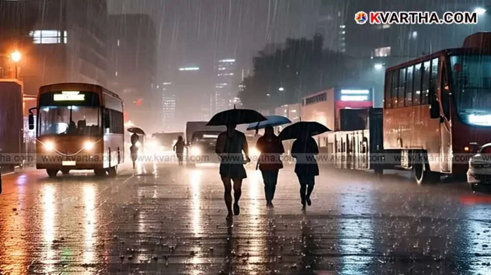 Heavy rain falling over a green landscape in Kerala.