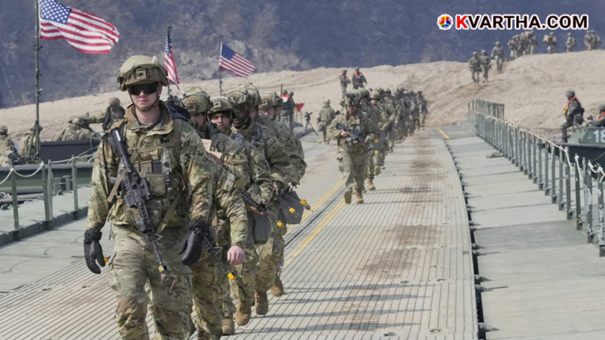 Representational image of US military landing craft and helicopters preparing for a coastal operation in March 2026.