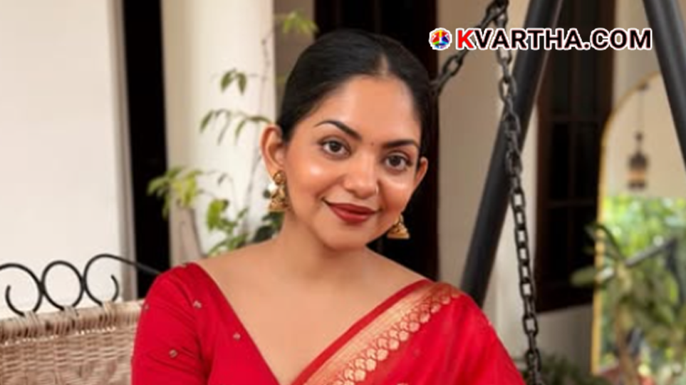 A portrait of Malayalam actress Ahana Krishna smiling during an interview, responding to her wedding rumors.