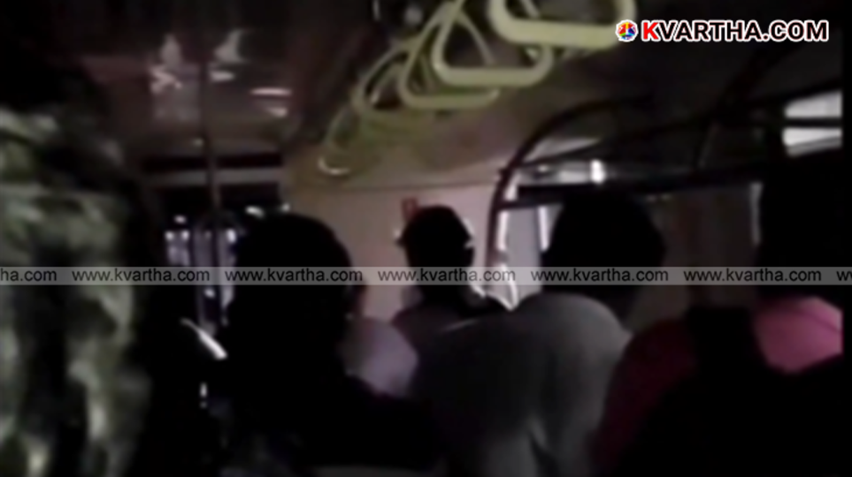 Passengers walking on the metro track inside a tunnel after a train breakdown.