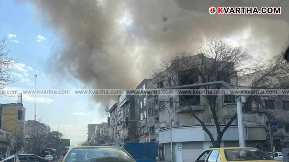 Explosions and fire over the city of Tehran during an air raid.