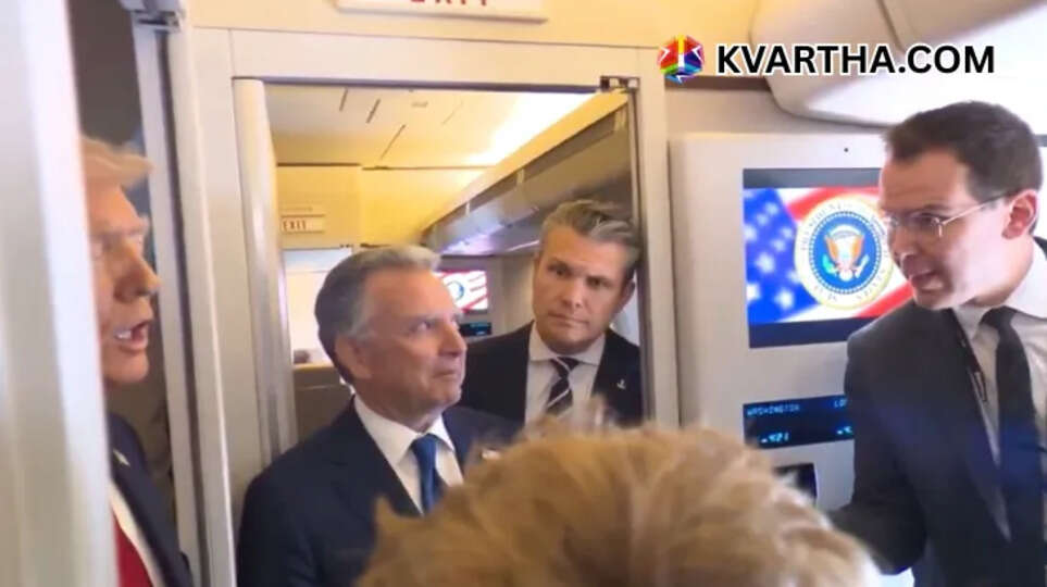 US President Trump speaking to reporters on Air Force One