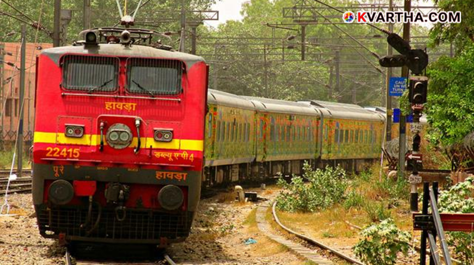 A railway police officer inspecting a train window damaged by stone-pelting in Kerala.