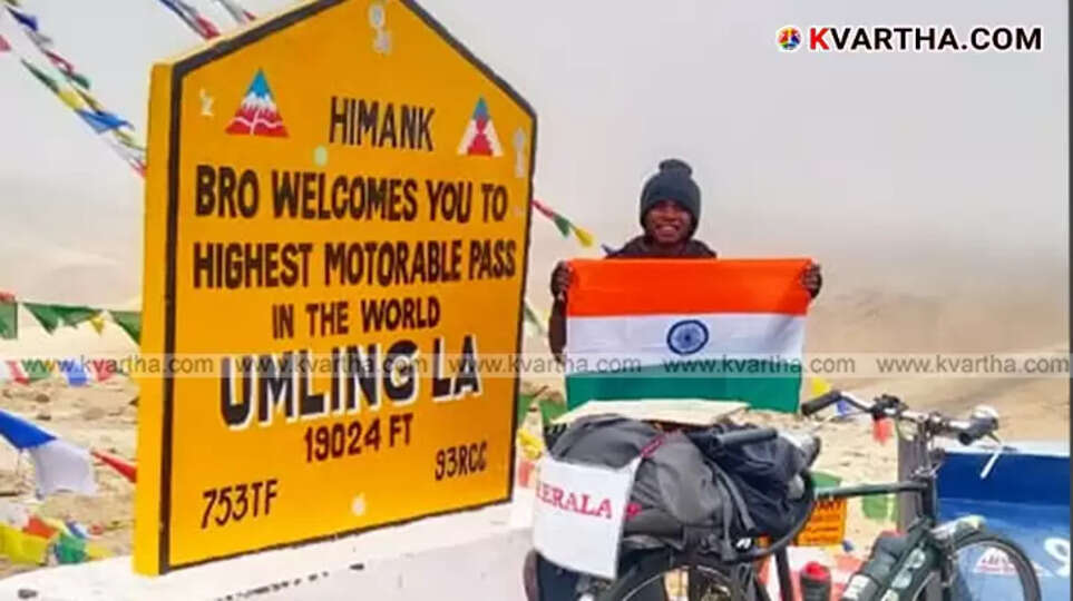 Cyclist Nithin receiving a cycle gift from Congress workers in Ladakh.