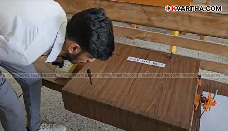 Young engineer Ajay H with his voice to handwriting robotic device