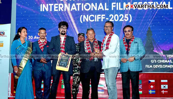  Director Aneesh Babu Abbas receiving the Best Feature Film award for 'Poov'