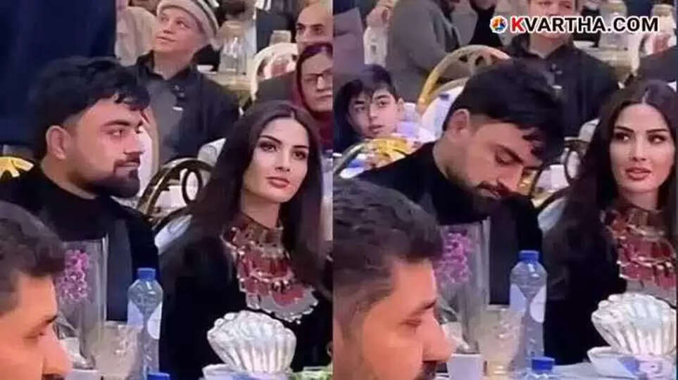Image of Rashid Khan with his wife in traditional Afghan attire during a charity event.