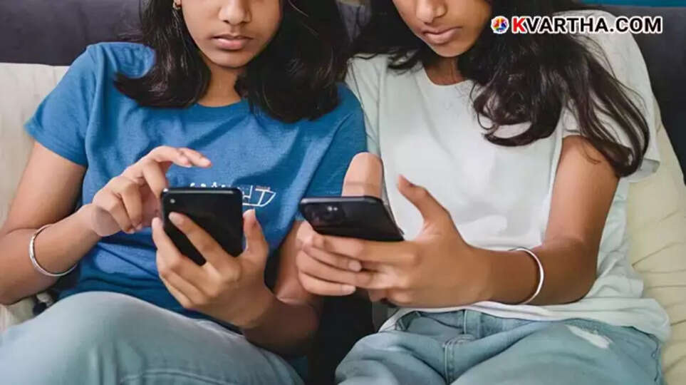 A teenage girl using a mobile phone.