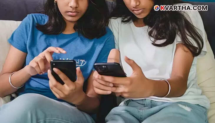 A teenage girl using a mobile phone.