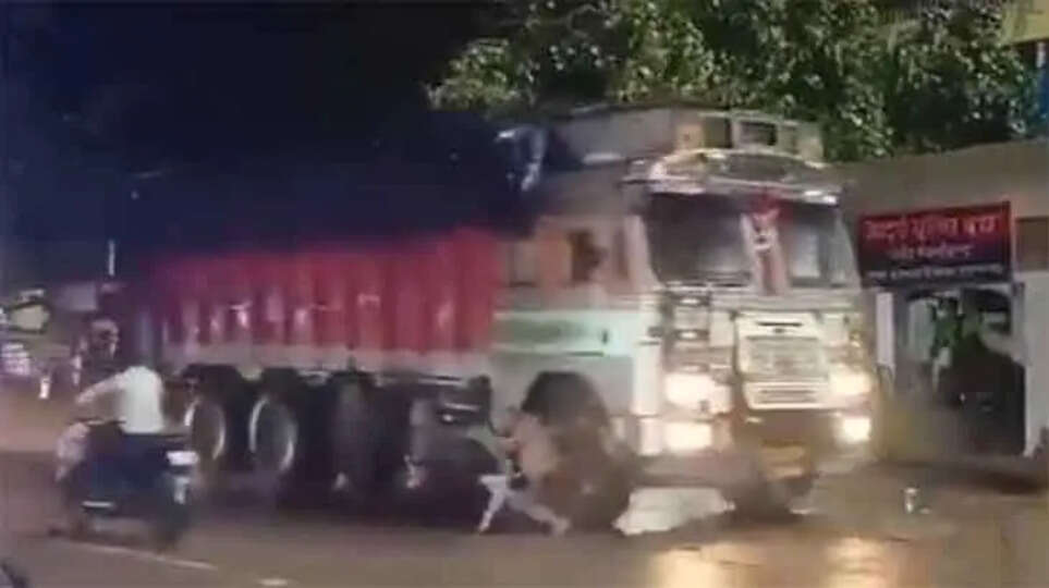 Man miraculously escapes after being hit by a truck while sitting on a road