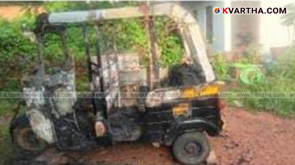 A burnt autorickshaw and a shed damaged by fire.