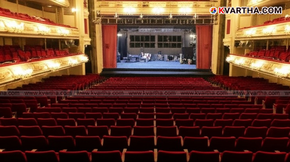A cinema hall with a movie playing, representing the new ticket price cap in Karnataka.