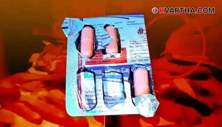 Close-up of a medicine capsule with a needle inside
