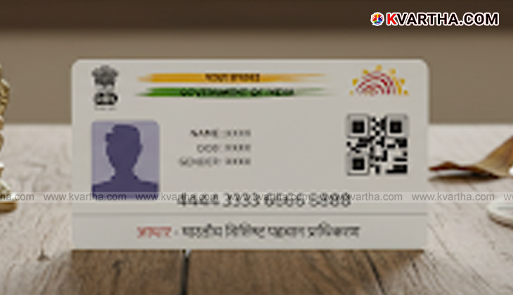 A smartphone displaying the e-Aadhaar app logo and features.