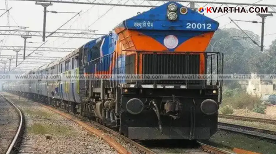 A view of an Indian Railways sleeper coach being added to an express train.