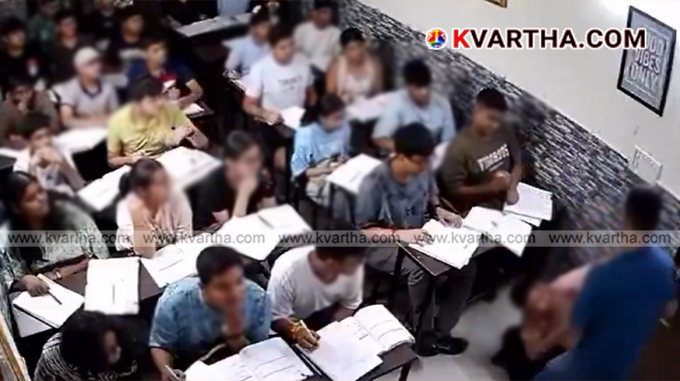 A screenshot from the viral video showing a teacher punishing a student in a classroom setting.