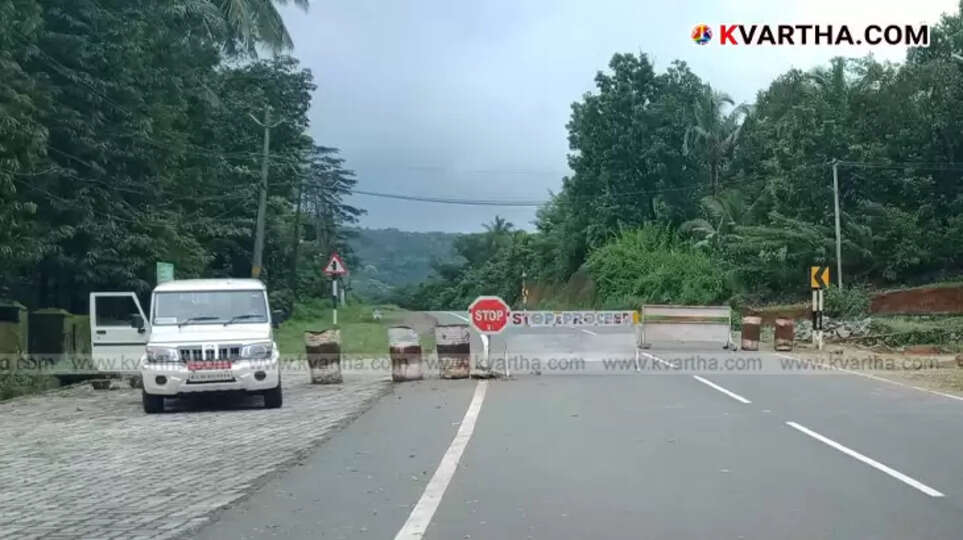 Scenic view of the Makkoottam Ghat road during monsoon season.
