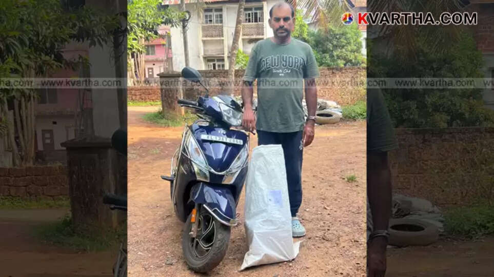 Excise team with seized Mahe liquor in Kannur.