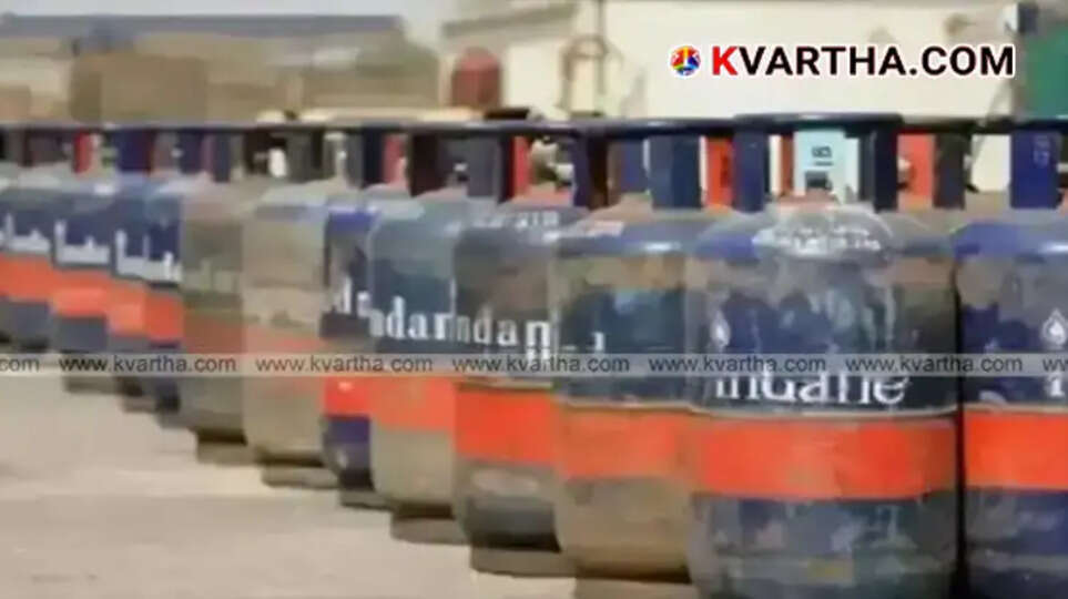 Image showing 19 kg commercial LPG cylinders stacked at a distribution center.