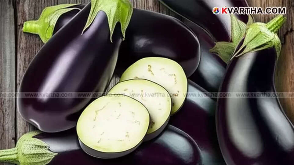 Fresh eggplants (brinjals) showing their vibrant color, symbolizing health benefits.