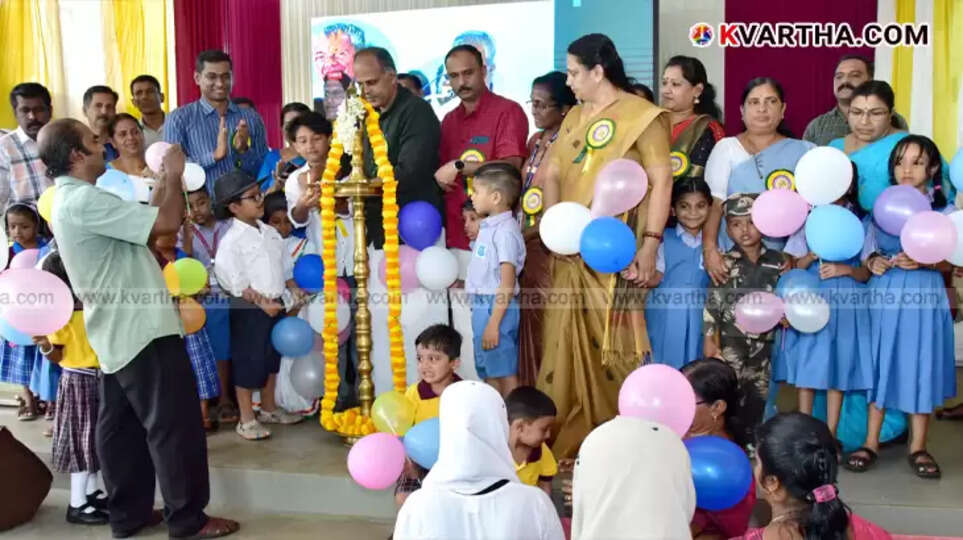 Happy children entering first grade during Praveshanolsavam in Kannur, holding balloons.