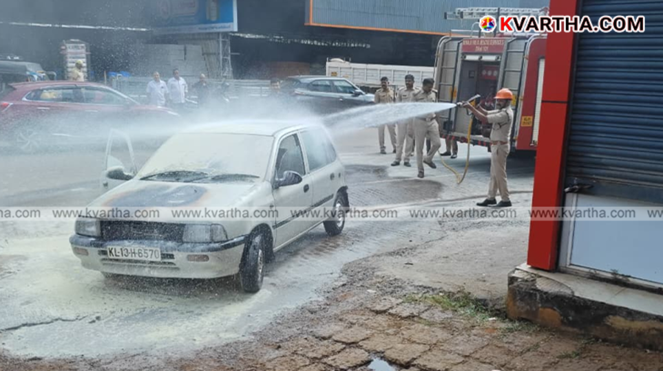 A car burning on the side of the road in Cherupuzha.
