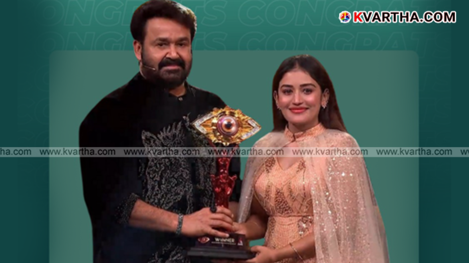  Big Boss Malayalam Season 7 winner Anumol celebrating with the trophy.