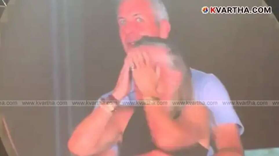  Still from the viral 'Kiss Cam' video at Coldplay concert showing a man and woman.