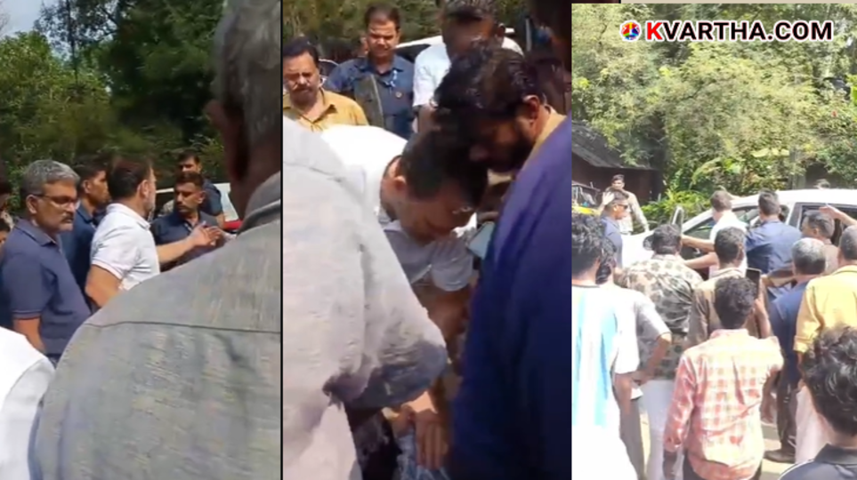 Rahul Gandhi and KC Venugopal standing on a road helping an accident victim during their 2026 Puthuppally visit.