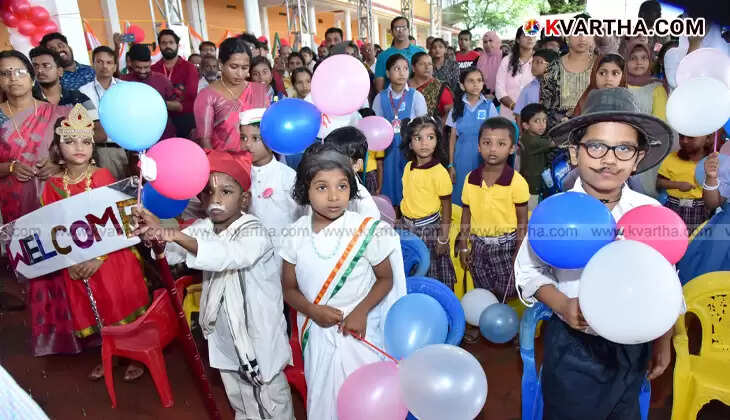Happy children entering first grade during Praveshanolsavam in Kannur, holding balloons.