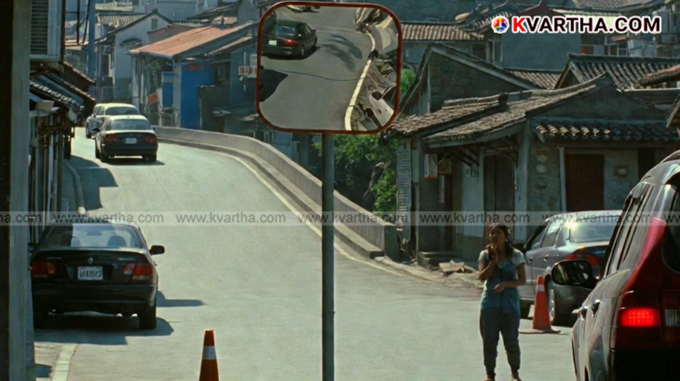  A convex traffic mirror installed on a sharp road curve.