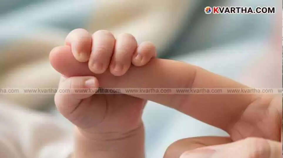 A newborn's tiny hand gently grasps an adult's finger, symbolizing care and tenderness.