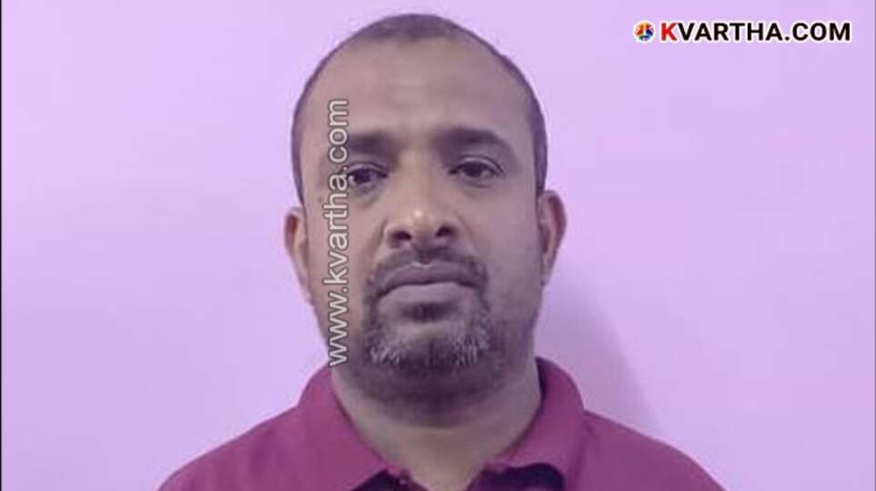 Kerala police arresting a suspect in an online trading scam.